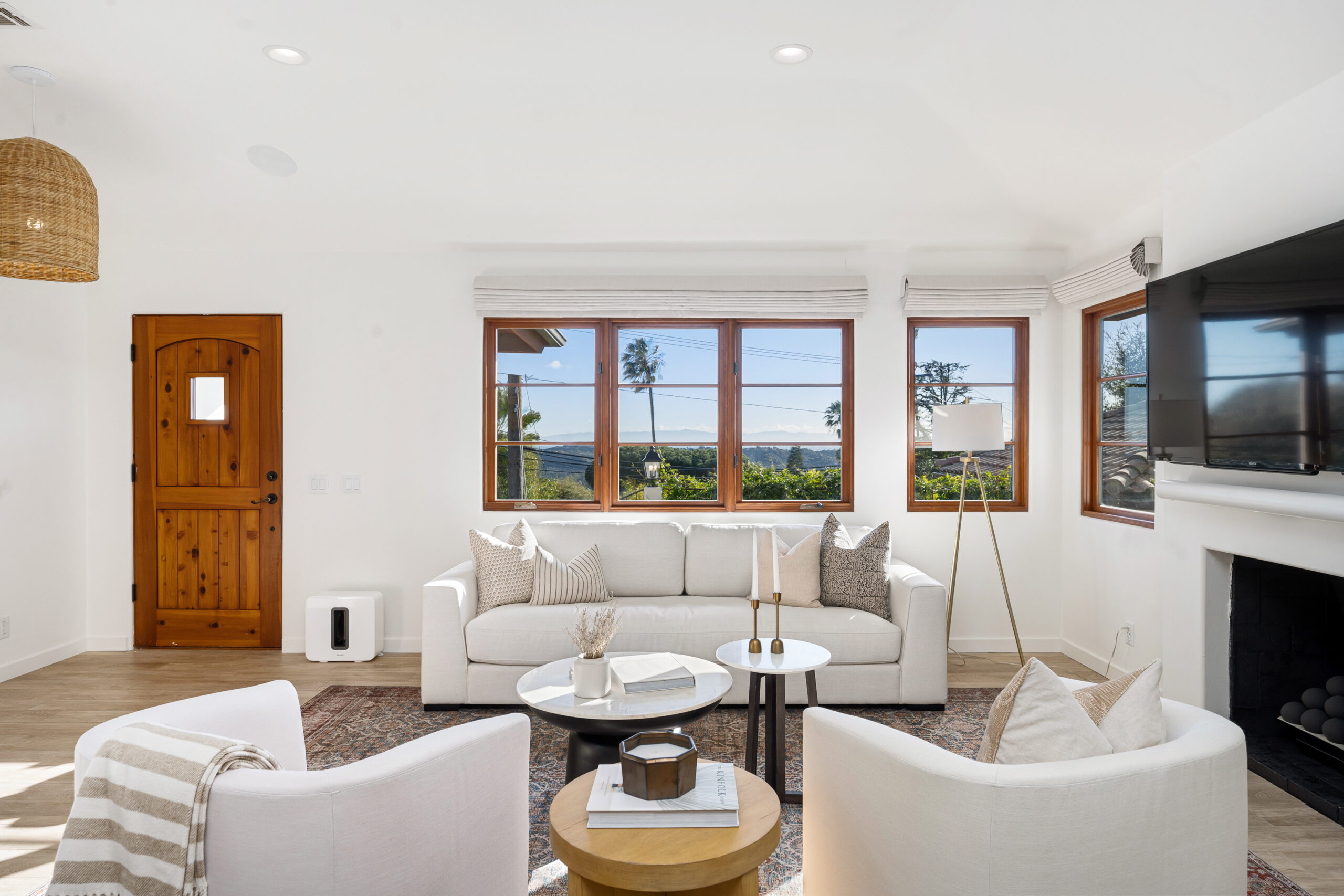 Bright coastal living room with ocean views through windows